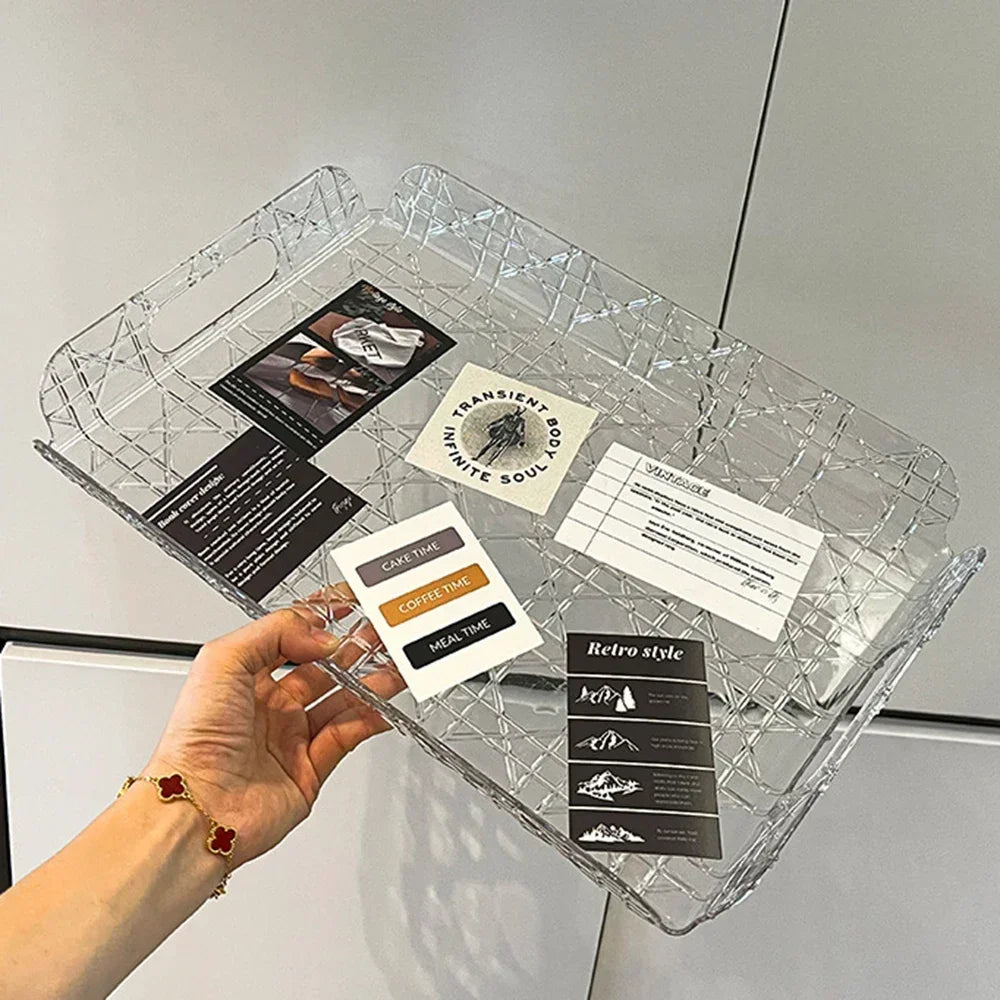 Clear rectangular tray with modern geometric pattern held in hand, seen with small cards