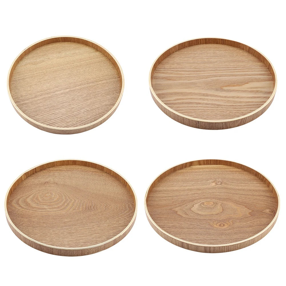 Set of four round wooden serving trays with rim in light ashwood finish