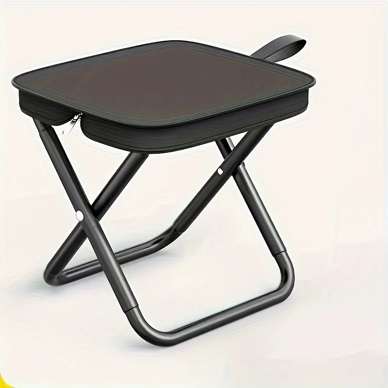 Black folding stool with handle and zippered seat, side view