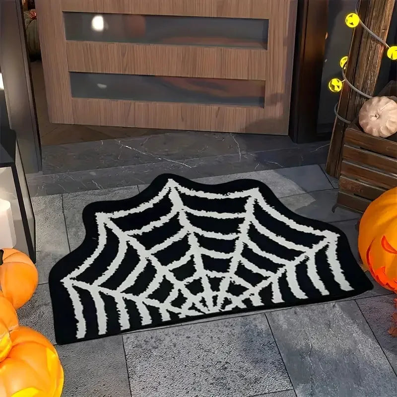 Black spider web shaped Halloween rug placed at an entryway with fall decor