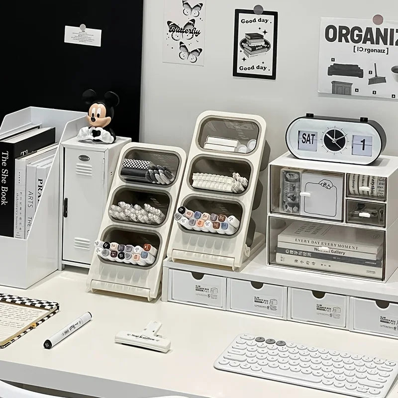 a tidy home office desk setup featuring two three-compartment desk organizers among supplies
