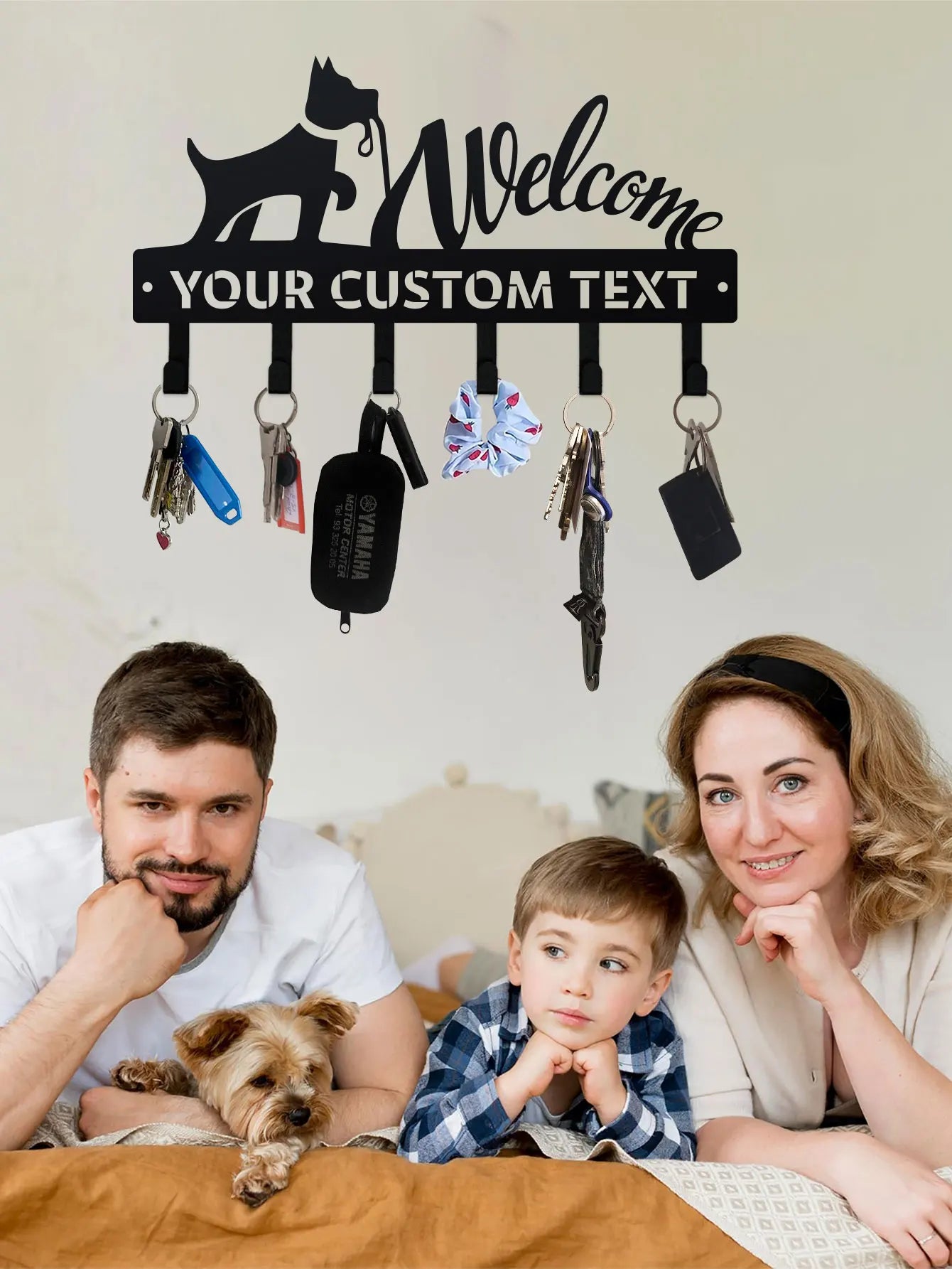 Custom wall-mounted key and leash organizer with family and dog, showing keys and accessories on hooks