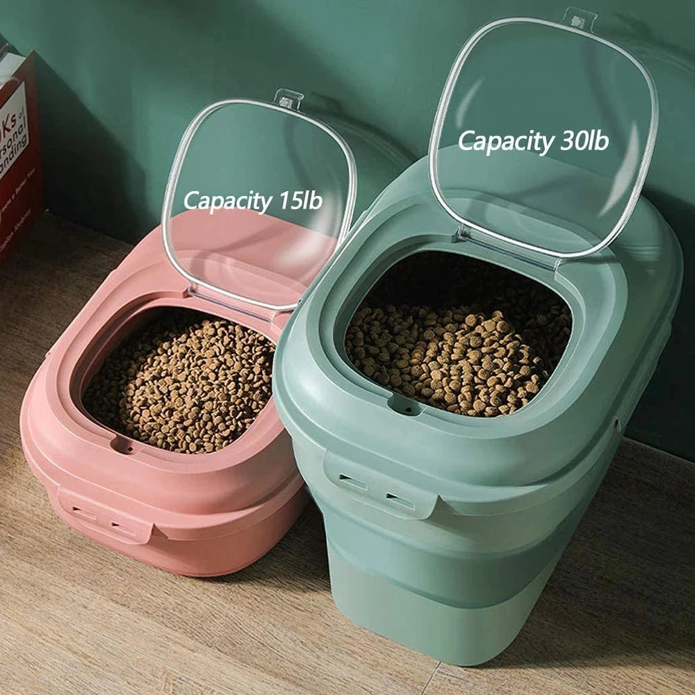 Green and pink foldable pet food containers side by side, both filled with dry pet food, lids open showing labeled capacity
