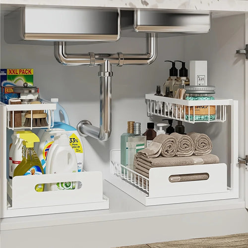 White 2-tier under-sink sliding organizers storing towels and bottles neatly in a kitchen cabinet