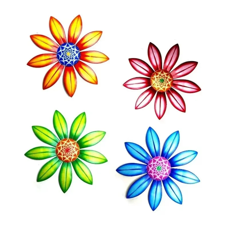 Set of four folk art metal flower wall decor pieces in red, blue, green, and orange