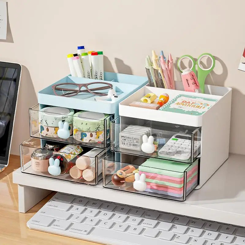 2-tier plastic desk organizer with clear drawers and bunny-shaped handles holding stationery and small items on a workspace