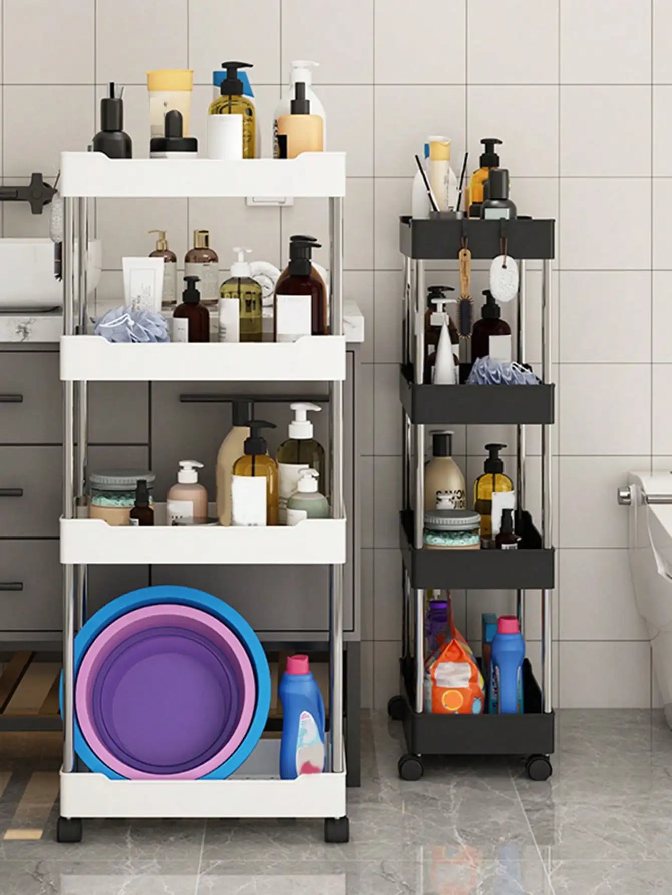 white and black rolling utility carts of different heights filled with bath supplies next to a sink