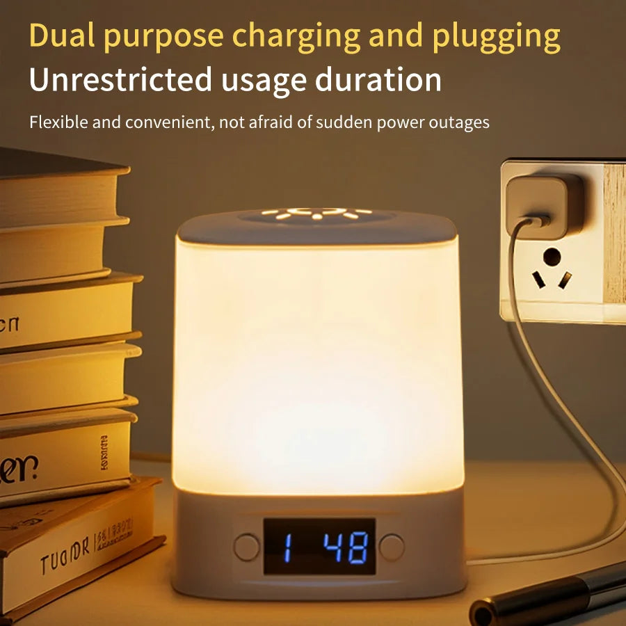 rechargeable night light with clock plugged into the wall, books and pen nearby on table