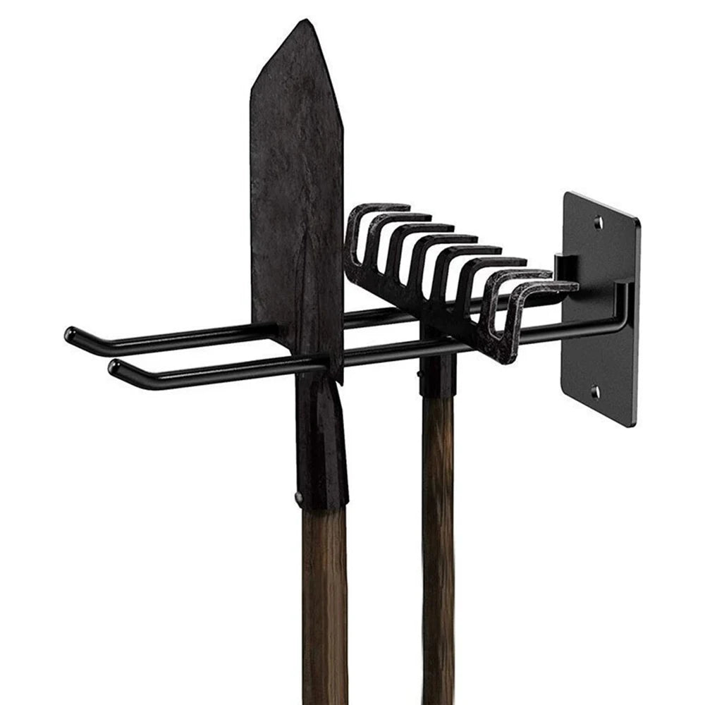 Metal wall hook holding a shovel and rake for organized storage