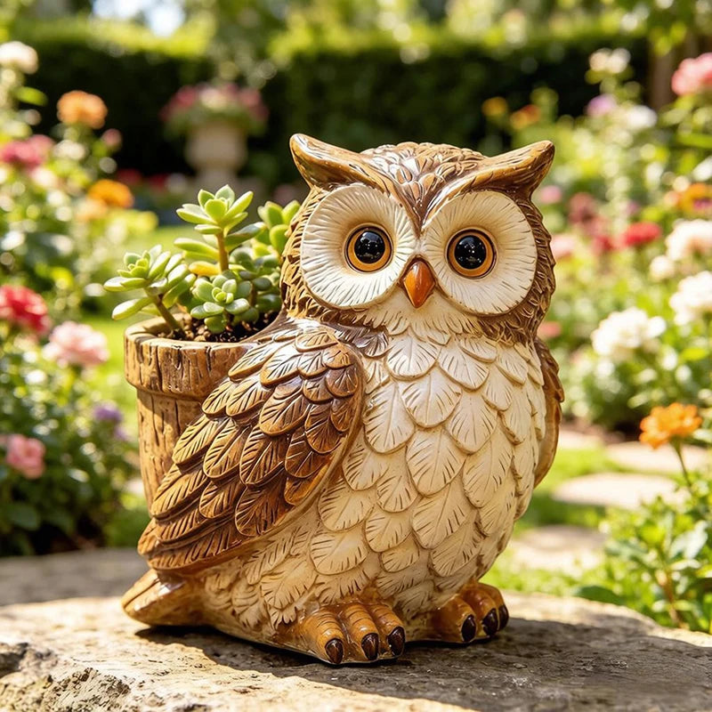 Owl-shaped resin planter pot with succulent, displayed in a garden setting