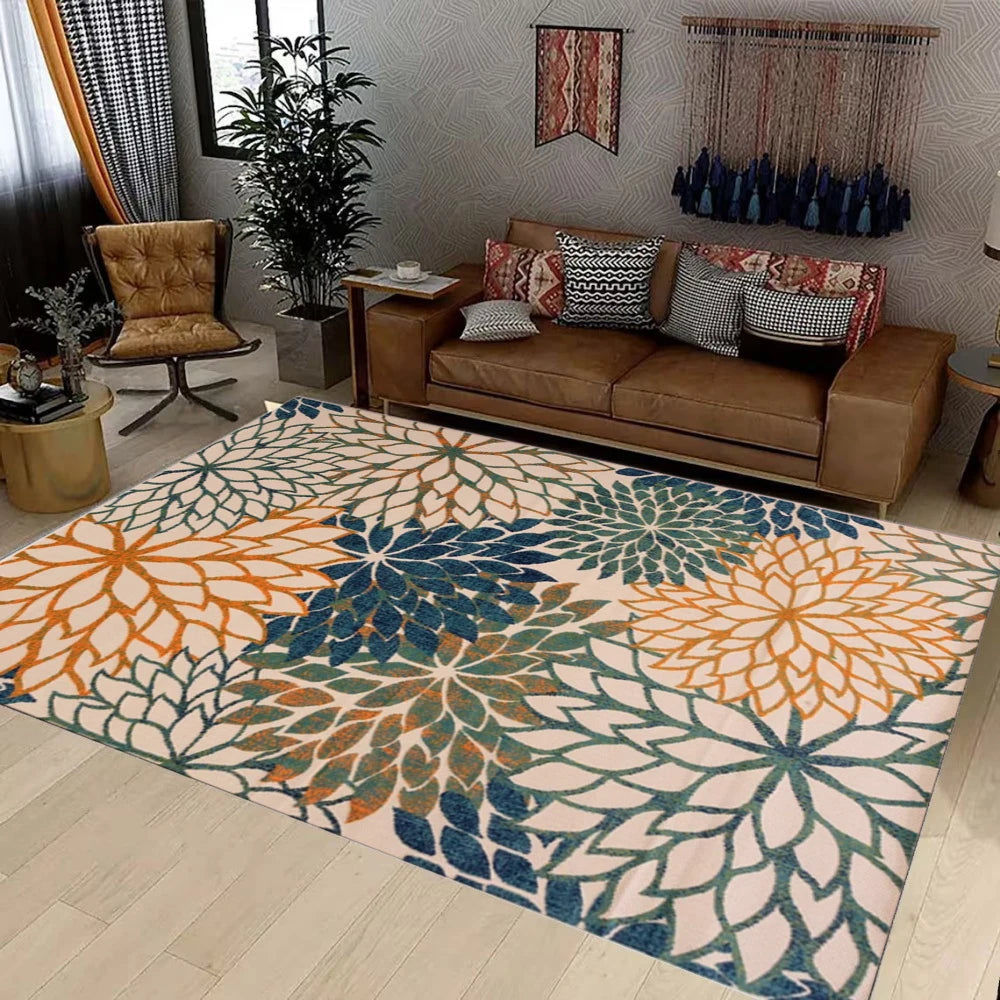 Botanical floral area rug with blue, orange, and green pattern in cozy living room