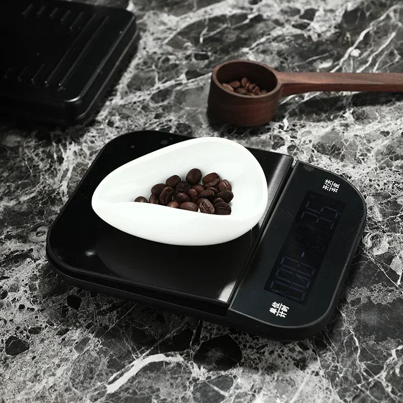 White ceramic tray with coffee beans on a kitchen scale