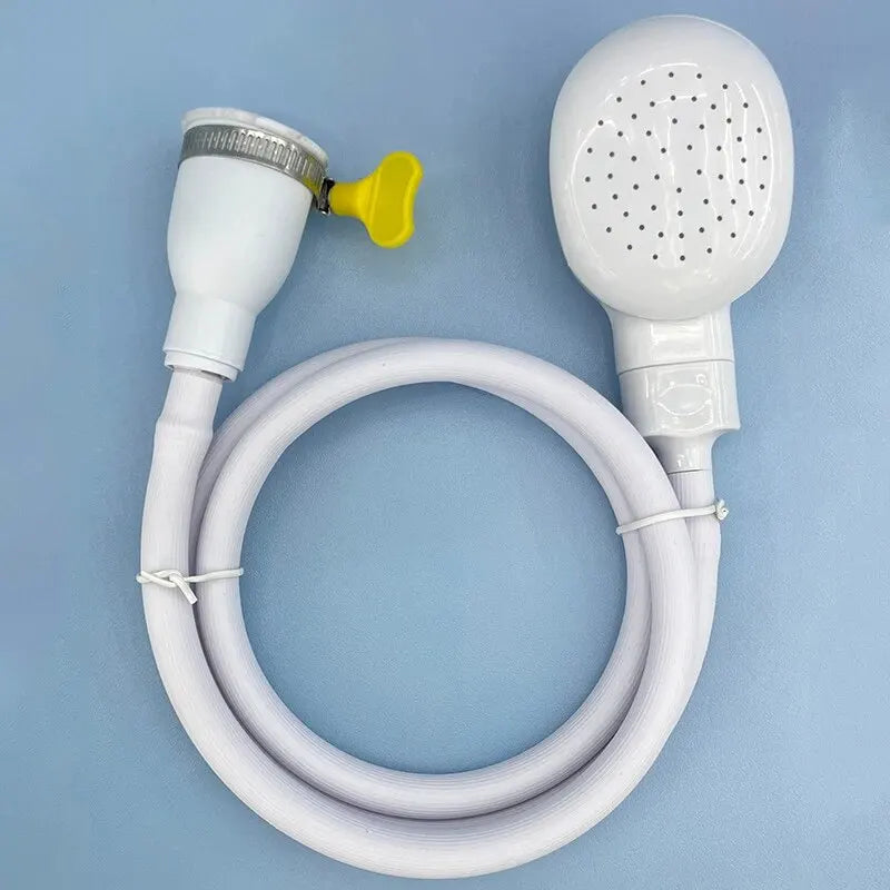 white handheld pet shower head and hose with clamp on blue background