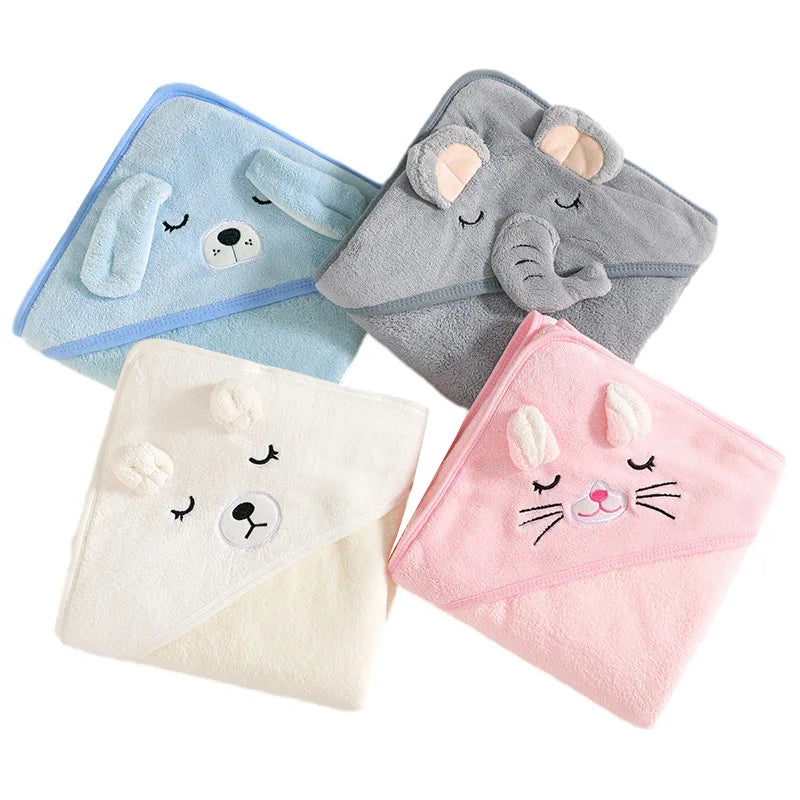 Four folded hooded baby bath towels in animal designs: blue dog, gray elephant, white bear, and pink cat