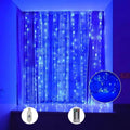Blue curtain fairy string lights adding a cool glow to a window area