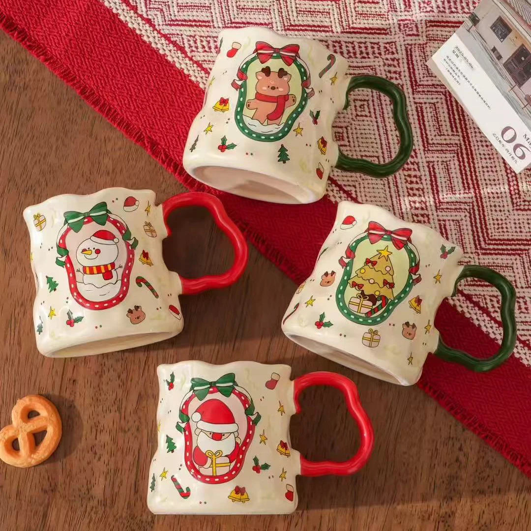 Set of four ceramic Christmas mugs featuring Santa, snowman, reindeer, and tree patterns with red and green handles