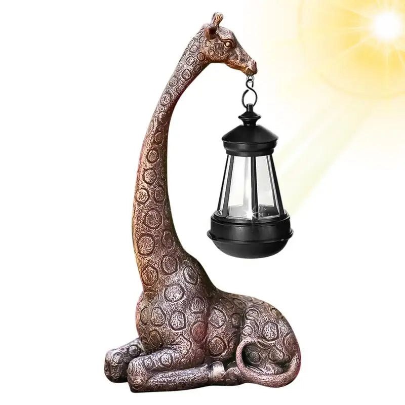 Bronze resin giraffe garden statue holding a solar lantern with warm white light
