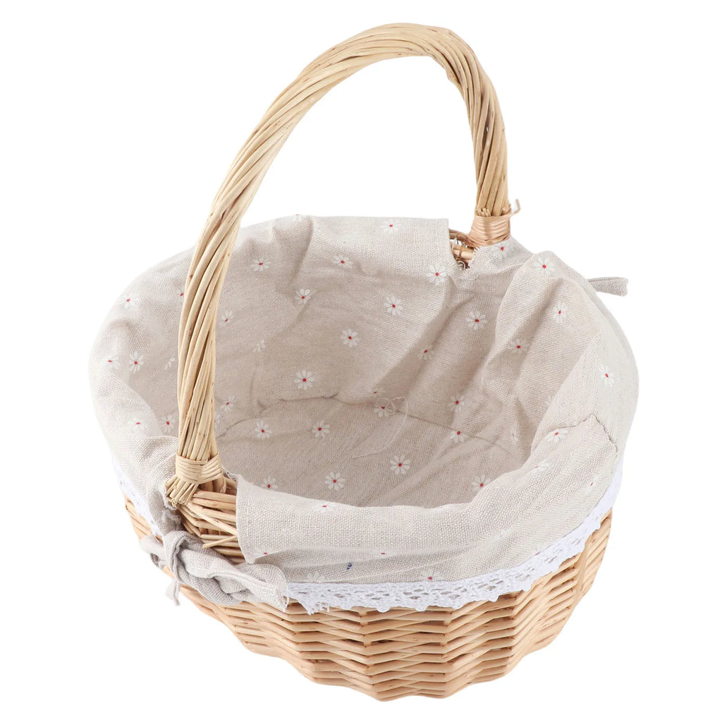 Top view of oval rattan basket with beige floral fabric liner