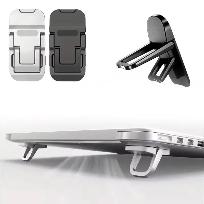 Black and silver adhesive laptop risers shown from the side and deployed on a laptop