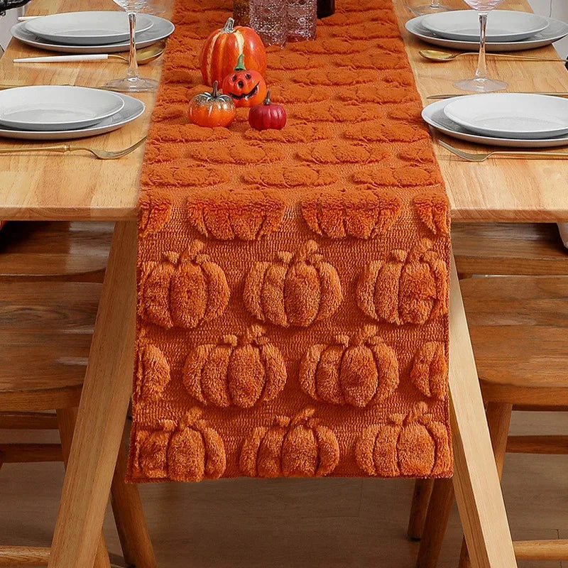 closeup of pumpkin pattern texture on orange table runner for autumn dining