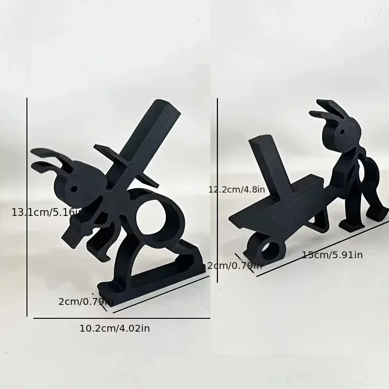 Close-up of ant silhouette tissue holders with visible measurements in centimeters and inches for each figure.