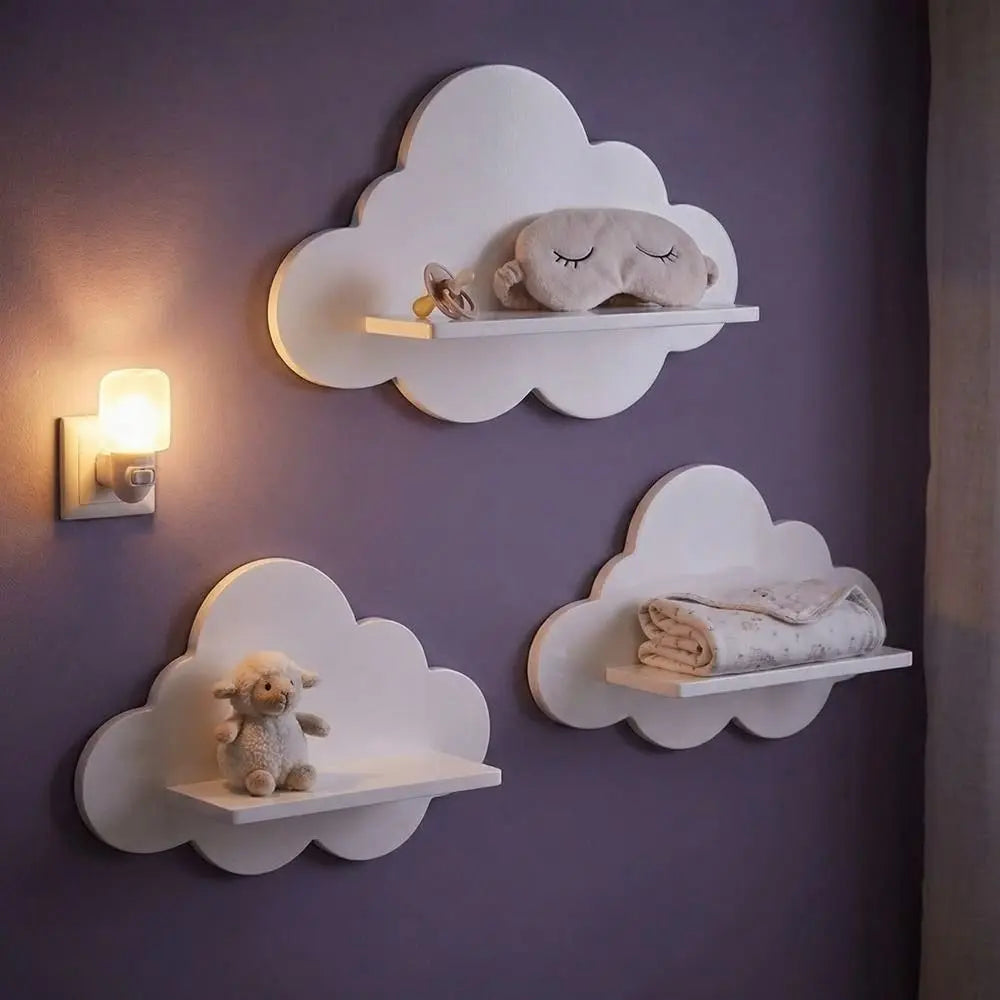Cloud floating shelves on a darker wall, holding nursery essentials and toys