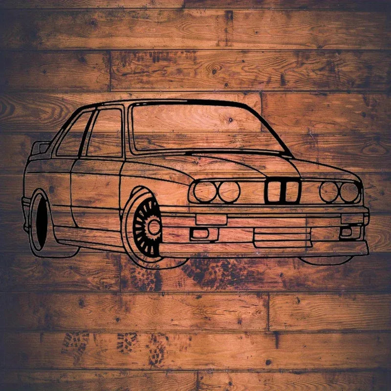 black metal car wall sculpture on wood panel wall