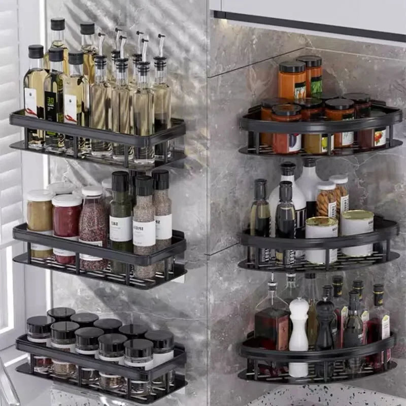 Adhesive black corner and rectangle shelves in a kitchen setting, storing bottles and jars for spices and oils.