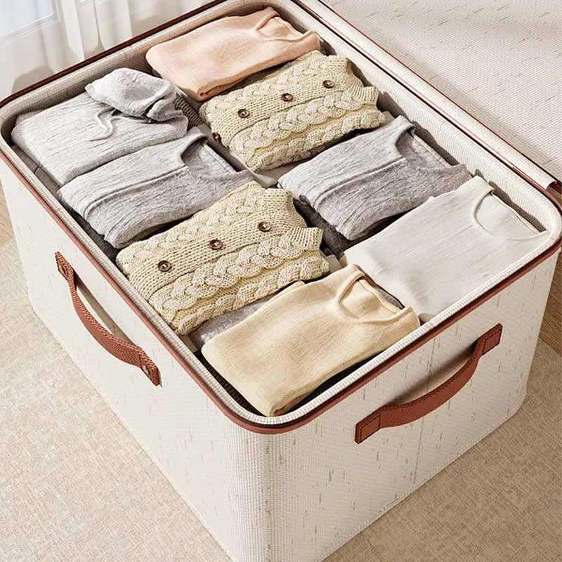 Large closet storage box neatly filled with folded sweaters and clothing