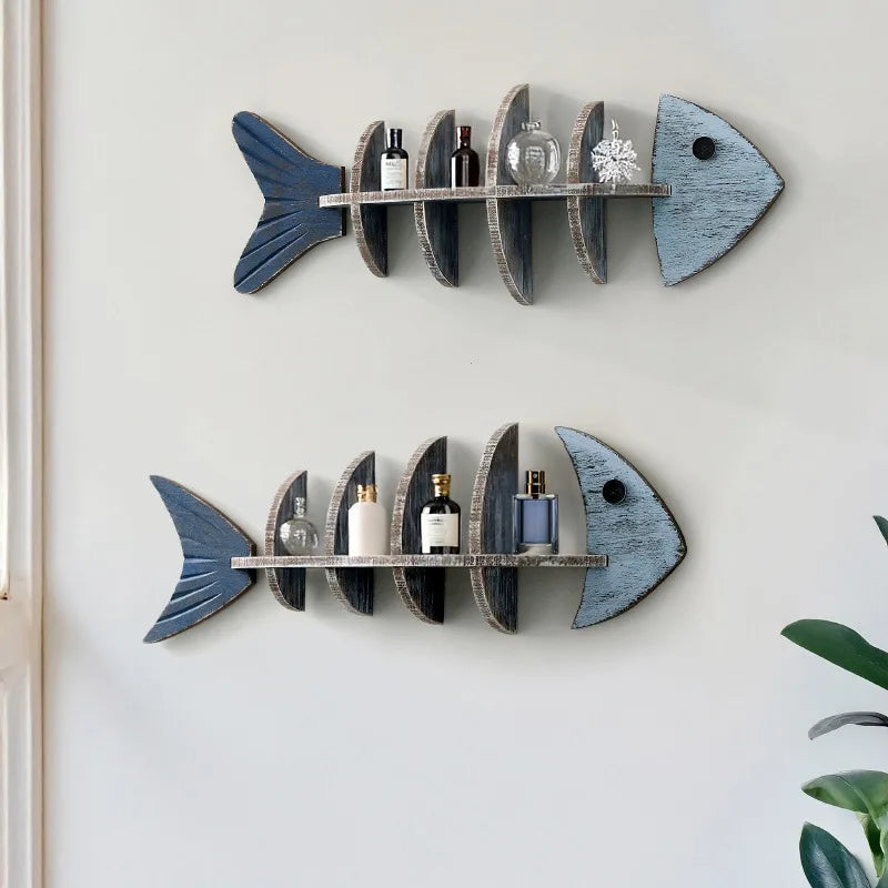 Pair of fishbone wooden wall shelves displaying bottles and decor