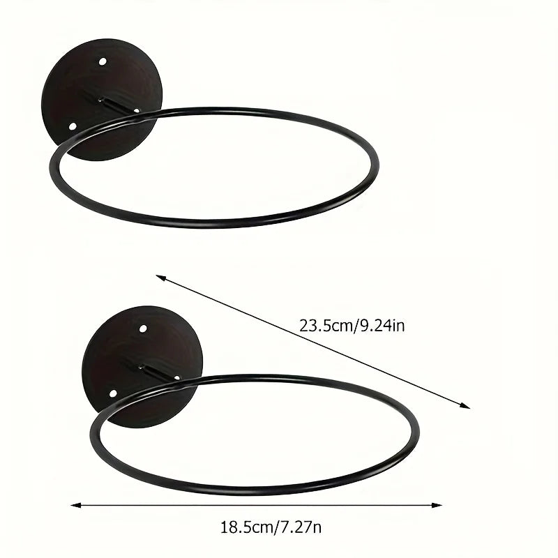 Two wall-mounted metal sports ball racks with labeled dimensions for height and width