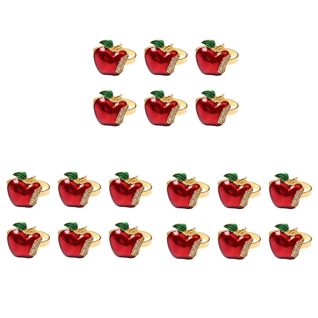 Set of 18 red and gold apple napkin rings with green leaf detail displayed on a white background