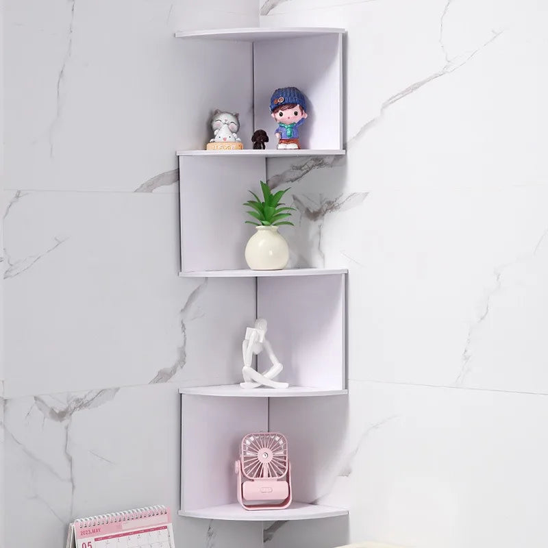 white 5-tier zigzag corner wall shelf mounted on a marble-tiled wall displaying decor and a plant