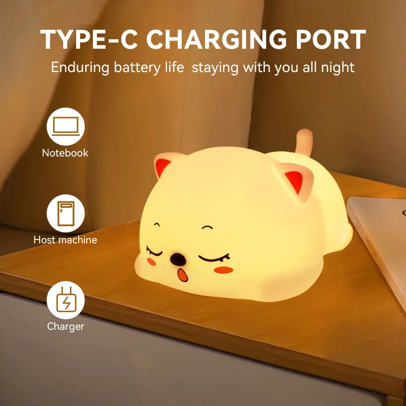 cat-shaped night light glowing on a bedside table with charging icons