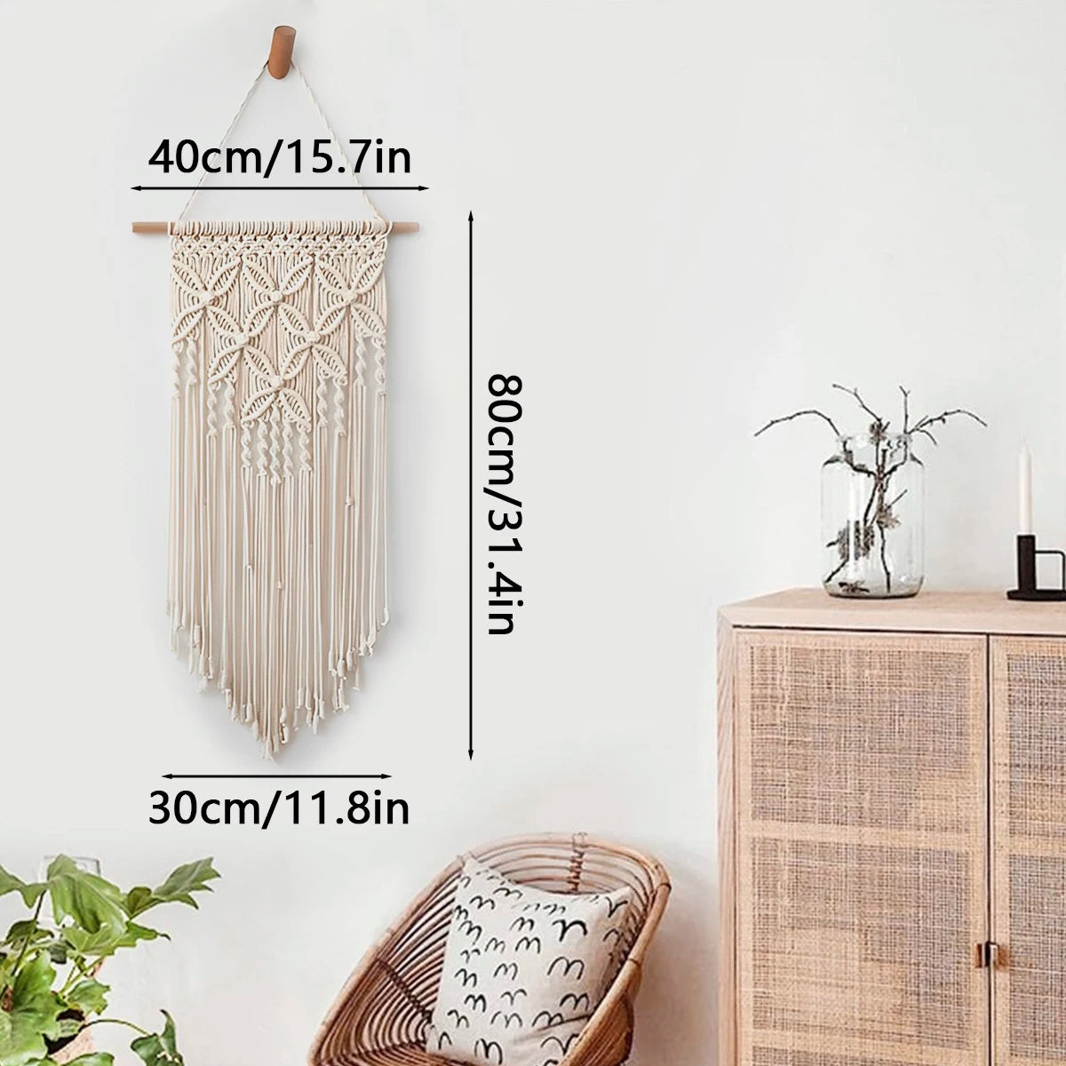 Beige macrame wall hanging with labeled dimensions on a white wall