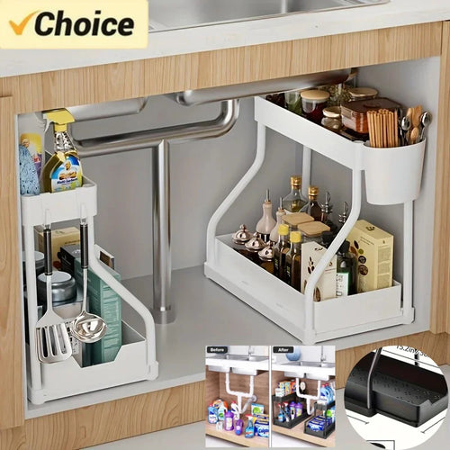 White two-tier pull-out under sink organizers neatly storing bottles, utensils, and cleaning supplies in a wood kitchen cabinet