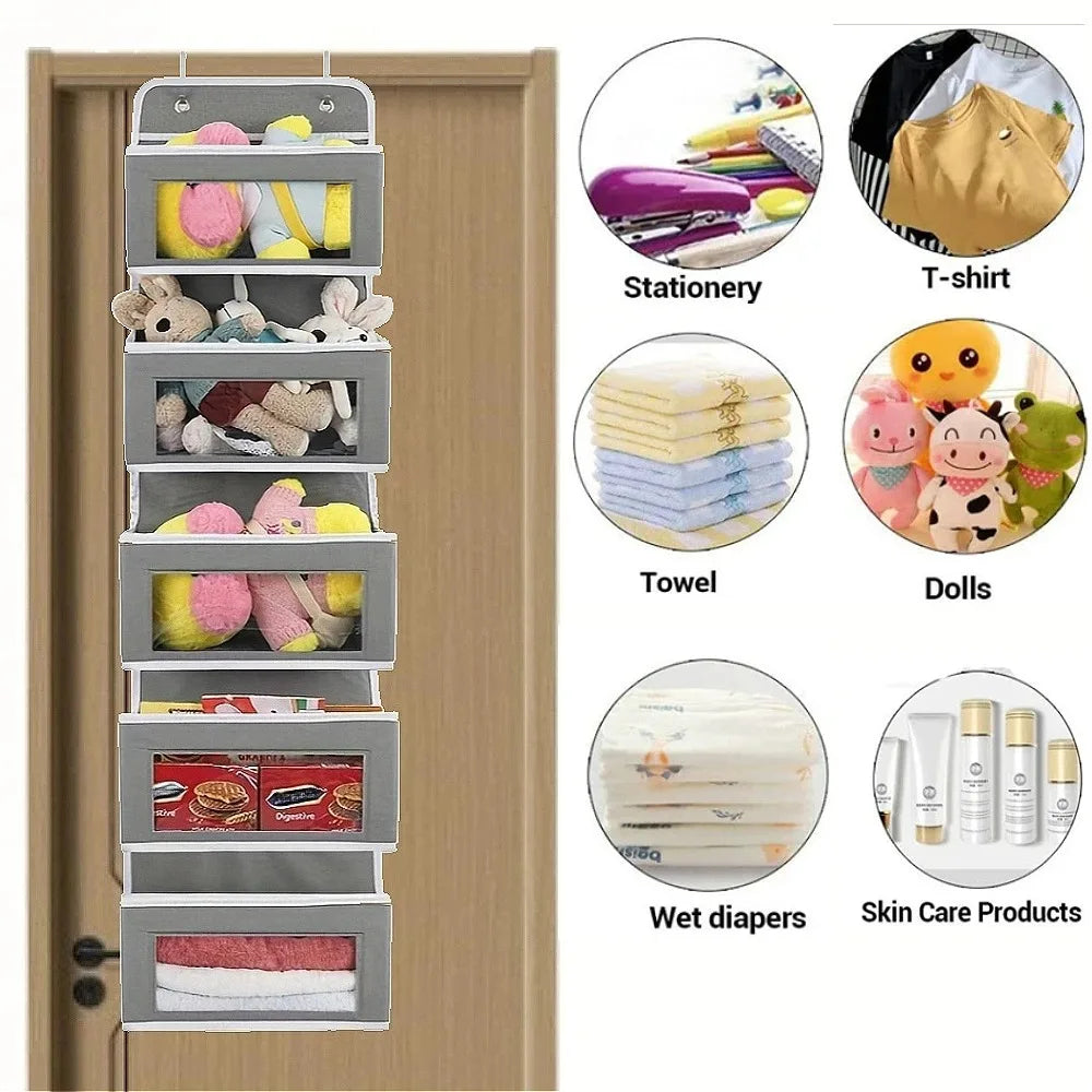 Grey hanging door organizer on a wooden door, with suggested items like stationery, t-shirts, towels, dolls, wet diapers, and skincare products