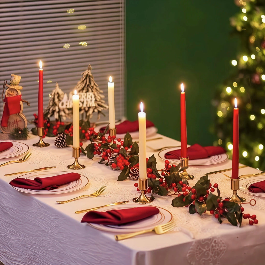 holiday dining table set with multiple gold taper candle holders, red napkins, and festive decorations