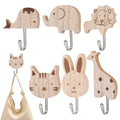 six bamboo animal wall hooks with metal hooks, including elephant, whale, lion, two cats, rabbit, and giraffe designs on a plain background