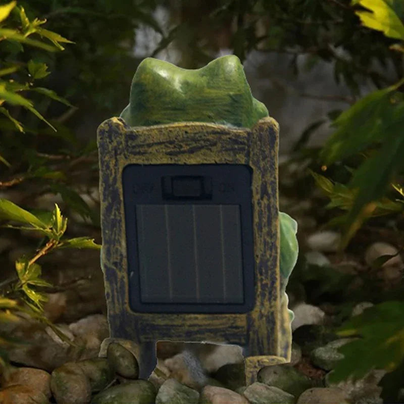 back view of frog solar light showing solar panel and on/off switch