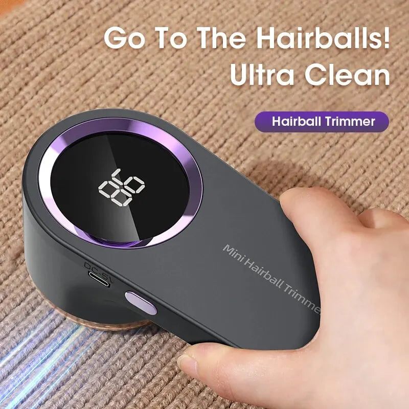 Grey fabric lint remover with purple ring being used on textured upholstery