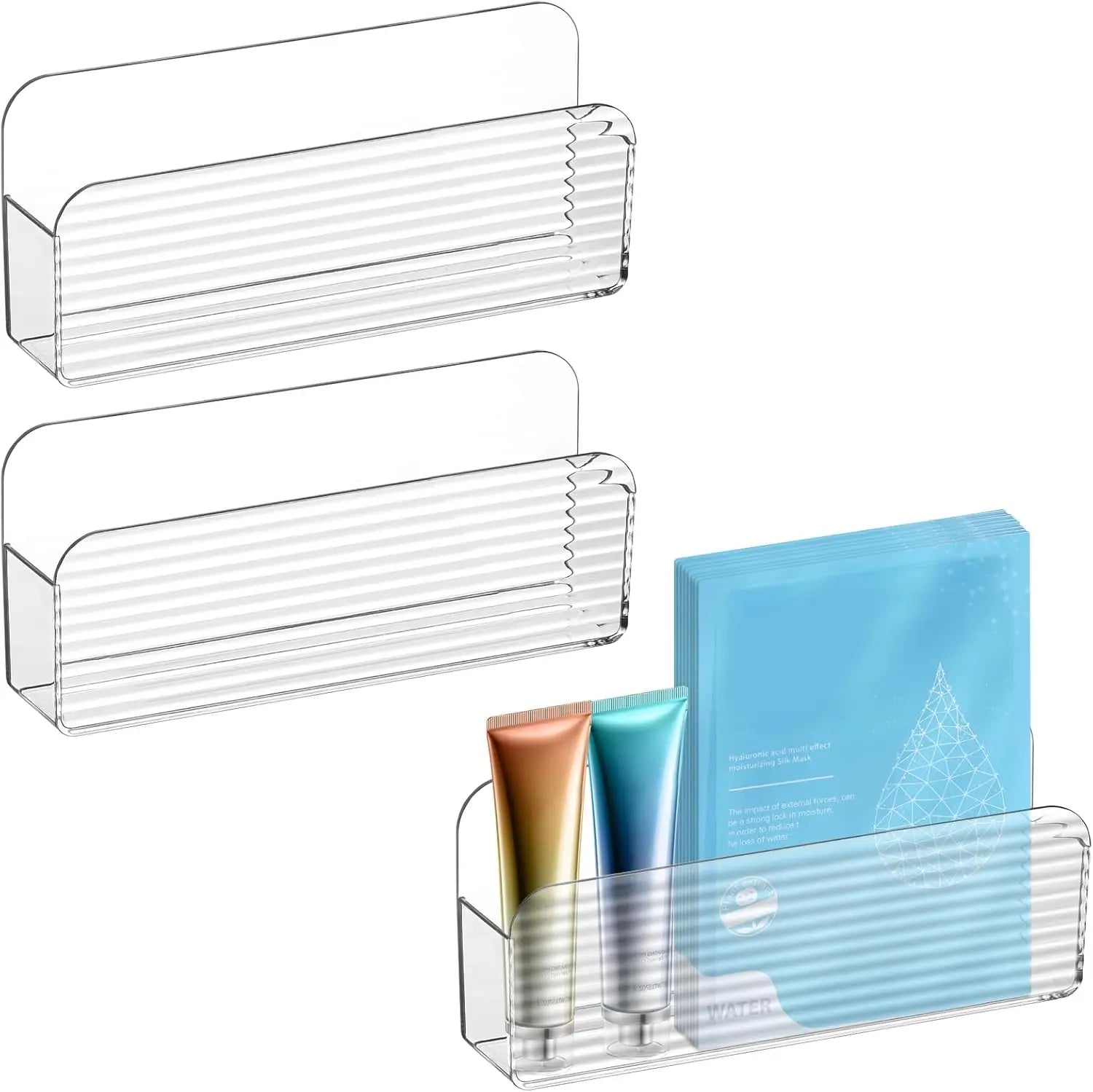 Two clear plastic wall-mounted storage bins, one filled with skincare tubes and packets