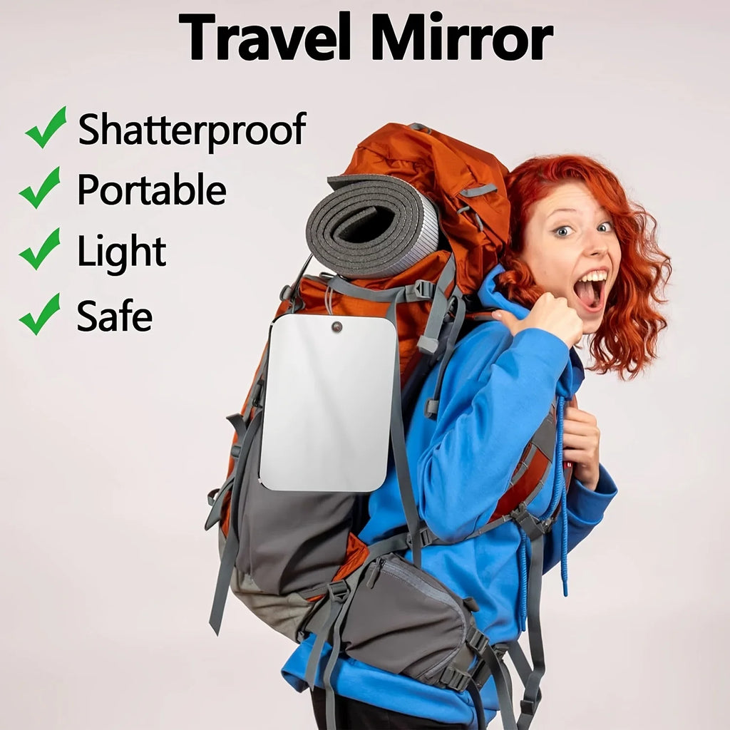 Portable acrylic mirror attached to a travel backpack with text indicating it's shatterproof and lightweight