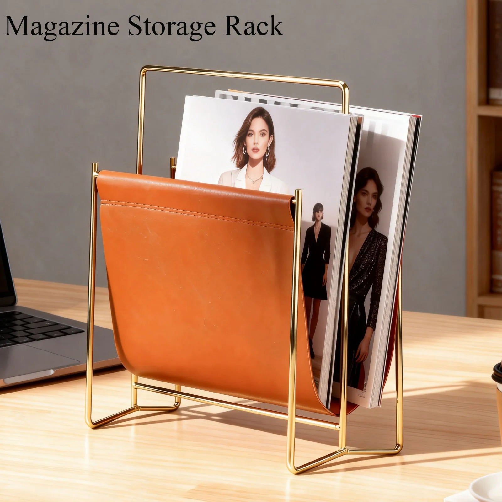 Brown faux leather and gold metal magazine rack on a wooden desk with magazines inside