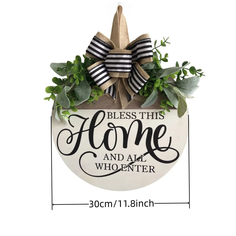 Round wooden welcome door sign with greenery and bow, measuring 30cm in diameter