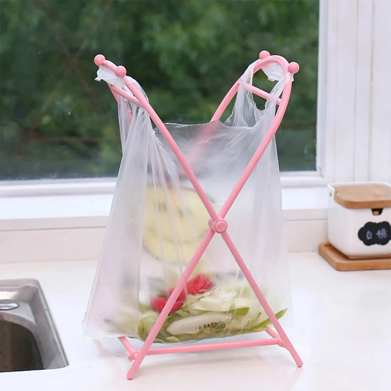 Rose red (pink) foldable plastic trash bag holder stand in use
