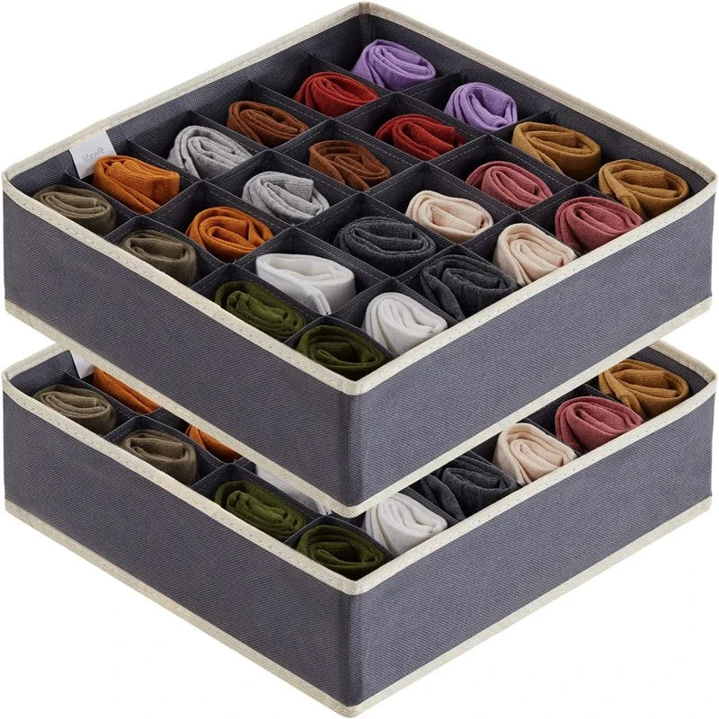 Two stackable gray 24-grid sock and underwear drawer organizer bins filled with rolled socks in assorted colors