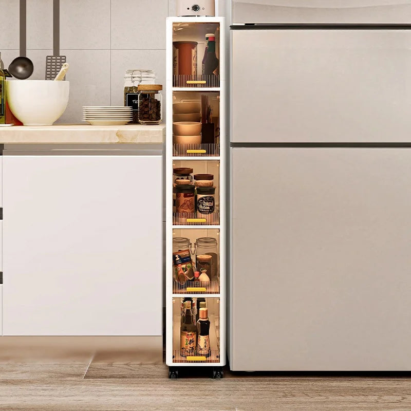 Tall slim rolling storage cabinet next to a refrigerator, organized with jars, bottles, and kitchen items