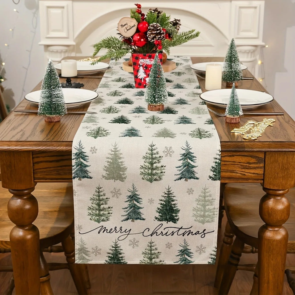 Natural linen-look Christmas table runner with green evergreen trees and snowflake pattern on a dining table