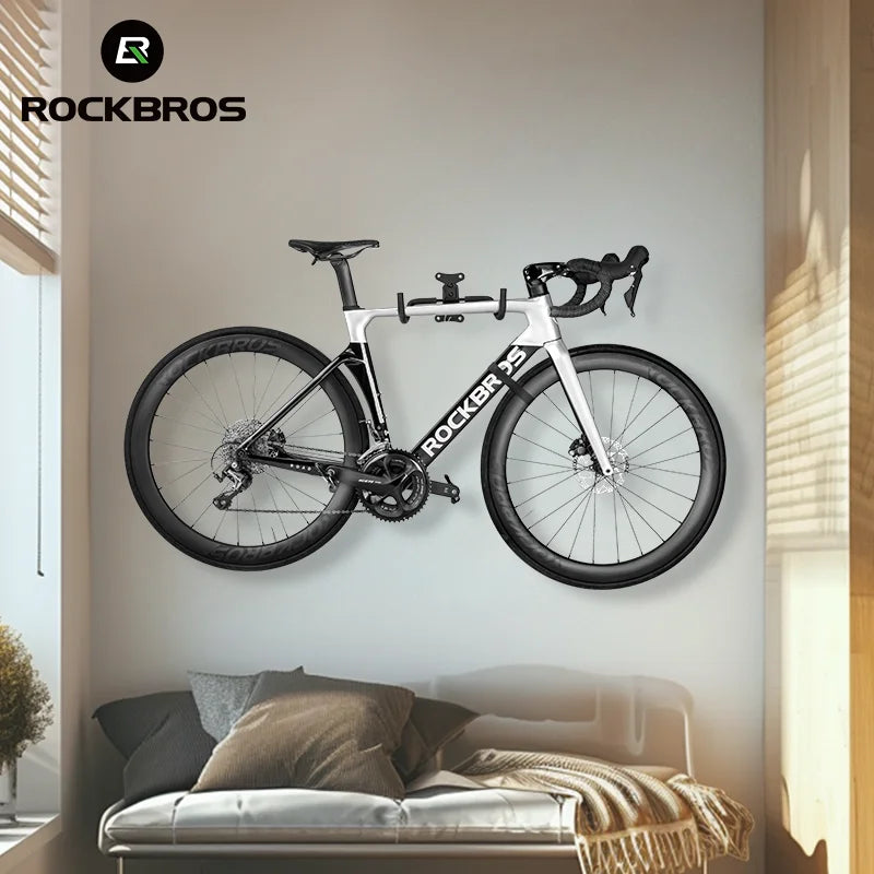 Horizontal bike rack mounted above a sofa in a living room or small apartment